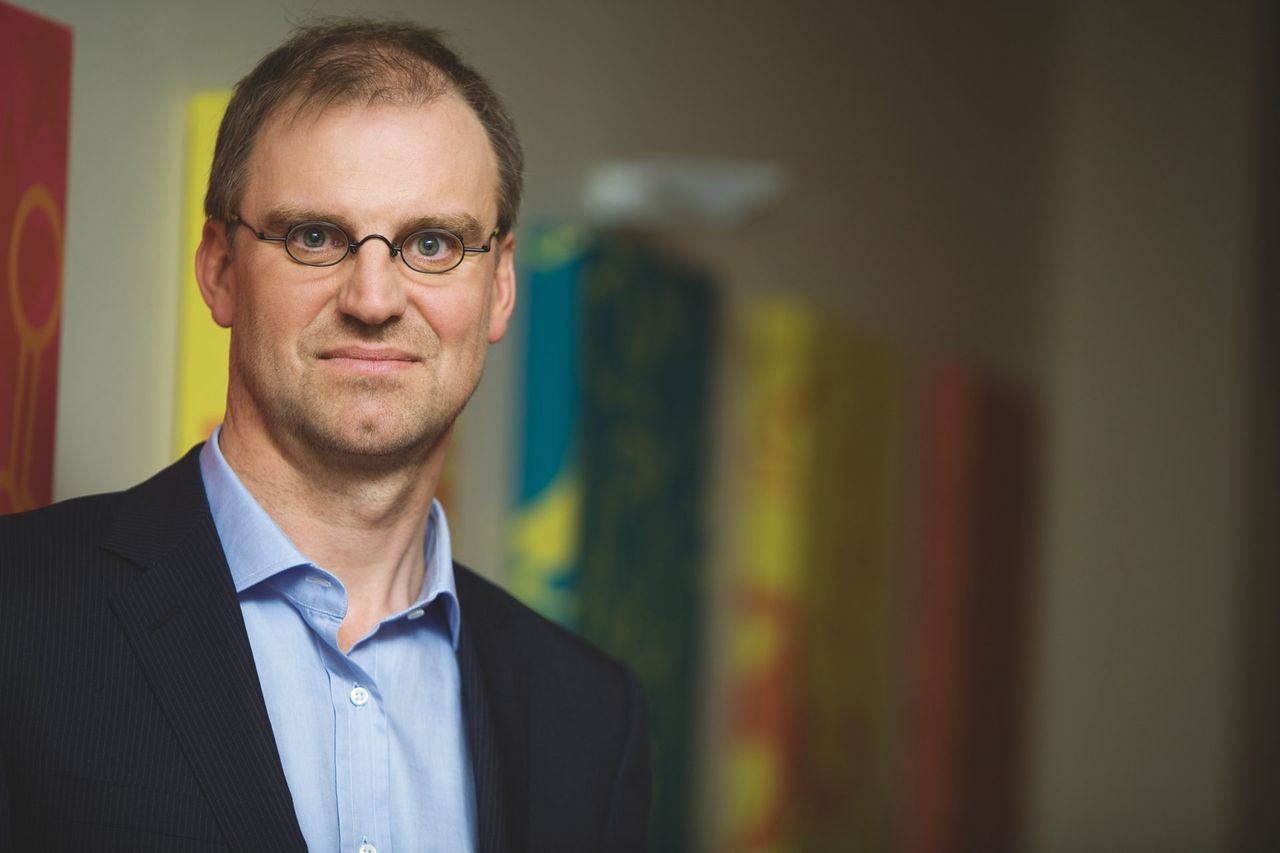 Hans Bourlon, co-creator of Studio 100, poses with confidence, symbolizing entrepreneurial success in youth entertainment.