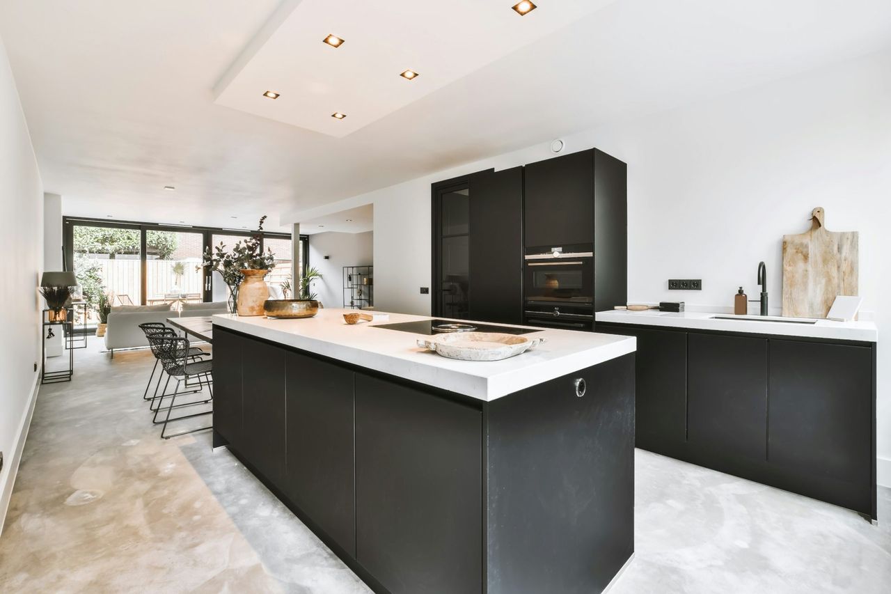 Modern kitchen design with clean lines and soft lighting, demonstrating Yves Puttemans' attention to detail at Dyls.