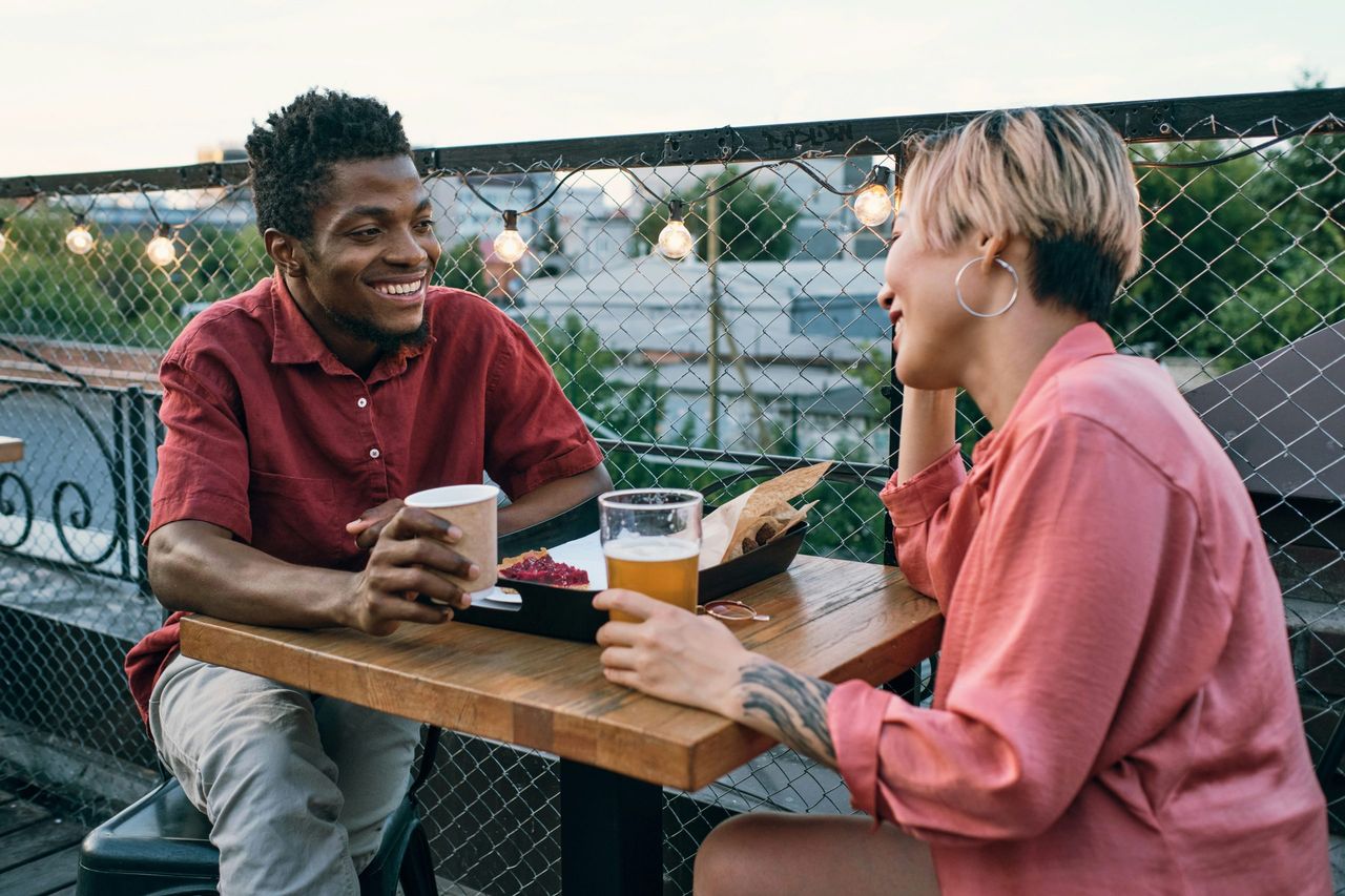 People on terraces enjoying Martens Family beer