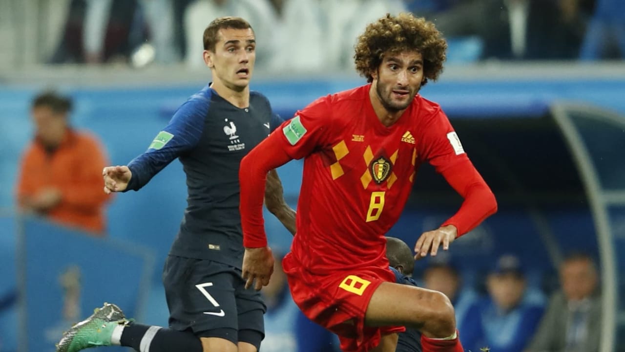 soccer duel between Marouane Fellaini and antoine griezmann