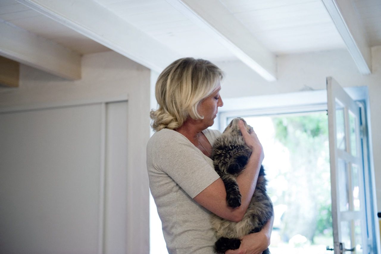 photo of Marine Le Pen and a cat